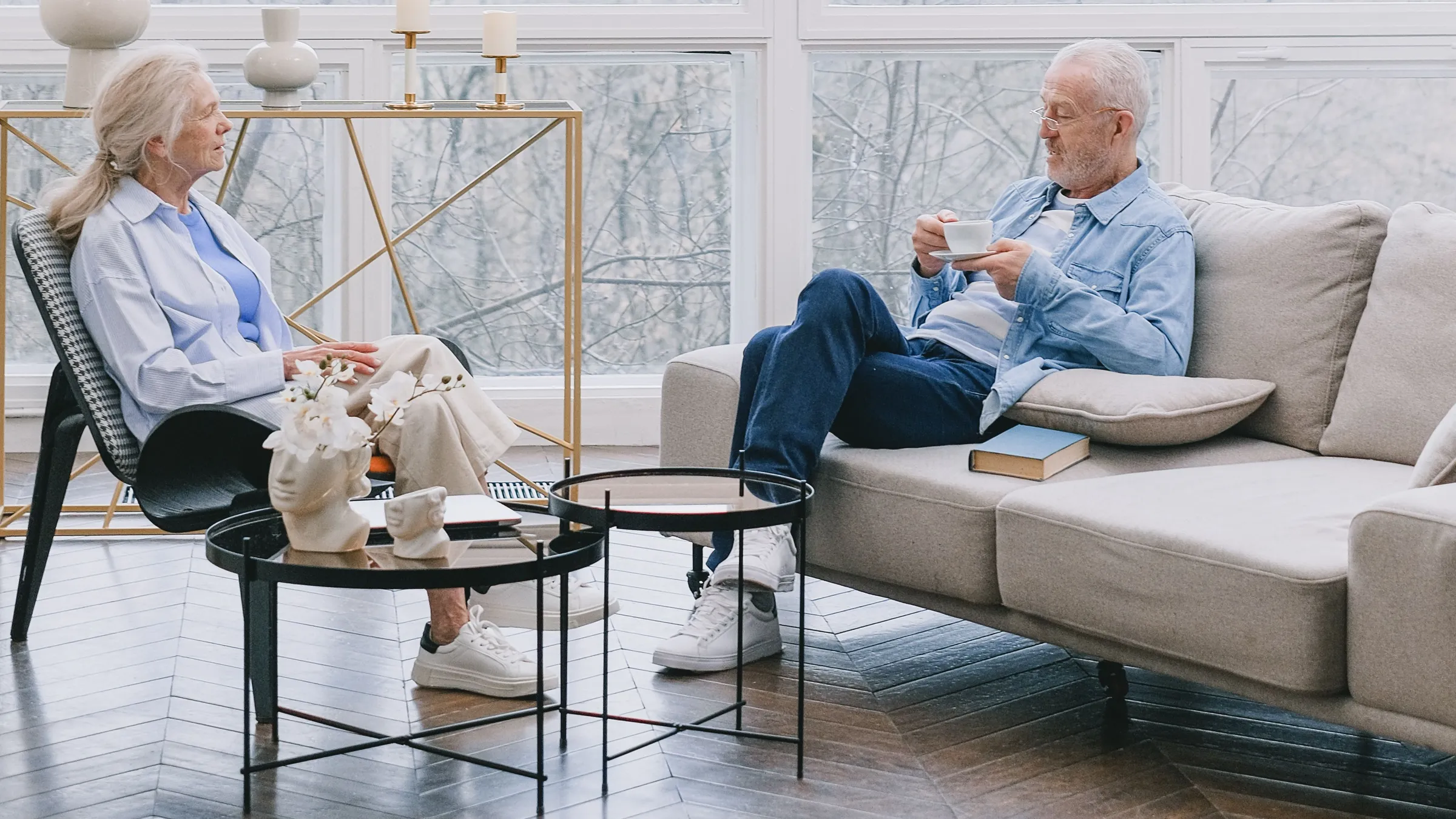 Senior couple relaxing in a bright lounge